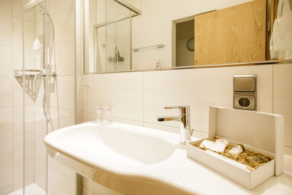 Double Room, Balcony, Mountain View | Bathroom | Shower, hair dryer, heated floors, towels