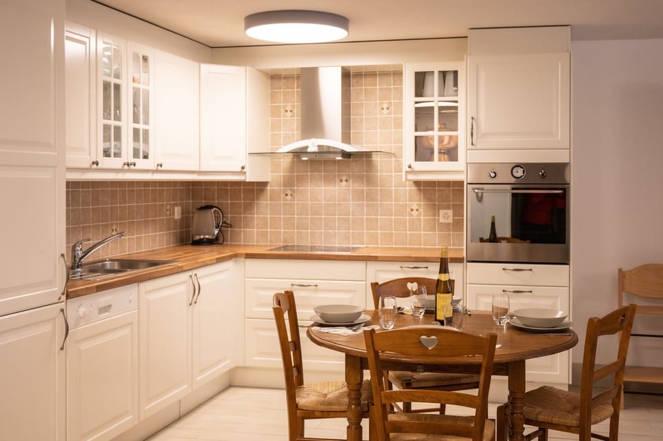 Family apartment plus 200 CHF cleaning fee on top of the rate | Private kitchen | Full-size fridge, oven, stovetop, dishwasher
