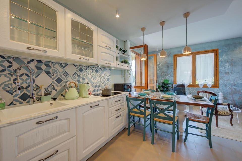 Family Apartment, Multiple Bedrooms, Mountainside (Pandora Lake View Stresa) | Private kitchen | Fridge, microwave, oven, stovetop