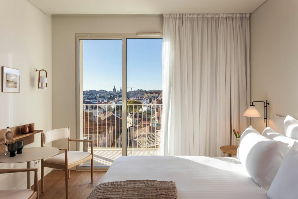 Balcony with City View | Down comforters, in-room safe, blackout drapes, soundproofing
