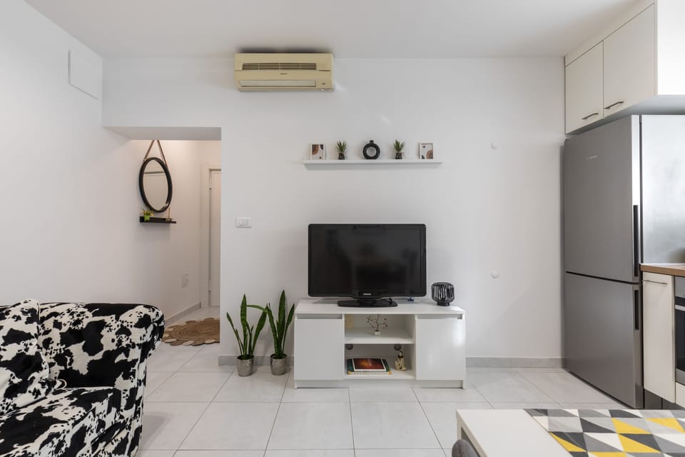 Deluxe Apartment | Living area | 150-cm LCD TV with digital channels, TV, toys
