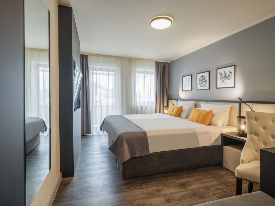 Business Suite, Balcony | Minibar, in-room safe, desk, laptop workspace