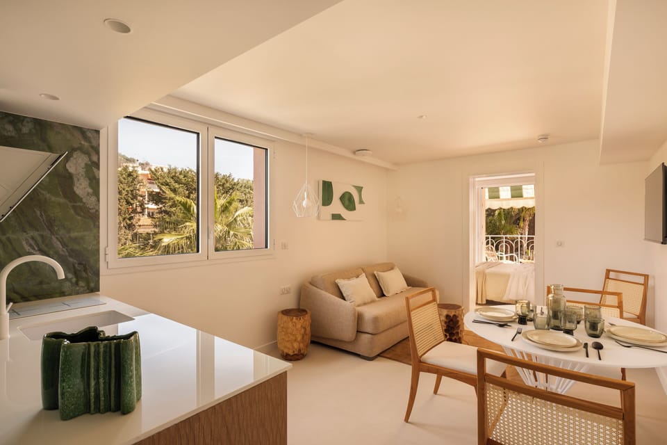 Signature Apartment | Living area | 40-inch flat-screen TV with digital channels