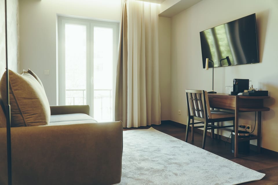 Premium Suite | Minibar, in-room safe, individually decorated, individually furnished