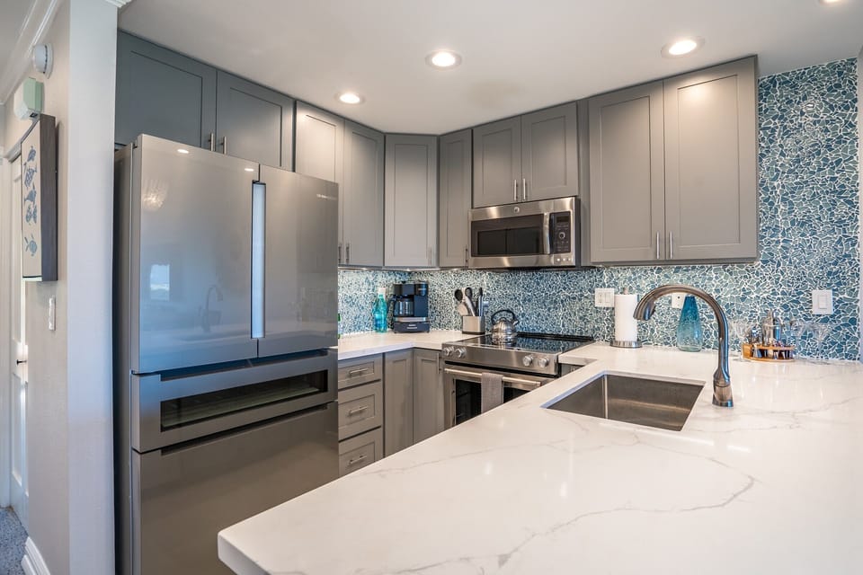 Luxury Condo | Private kitchen | Full-size fridge, microwave, oven, stovetop