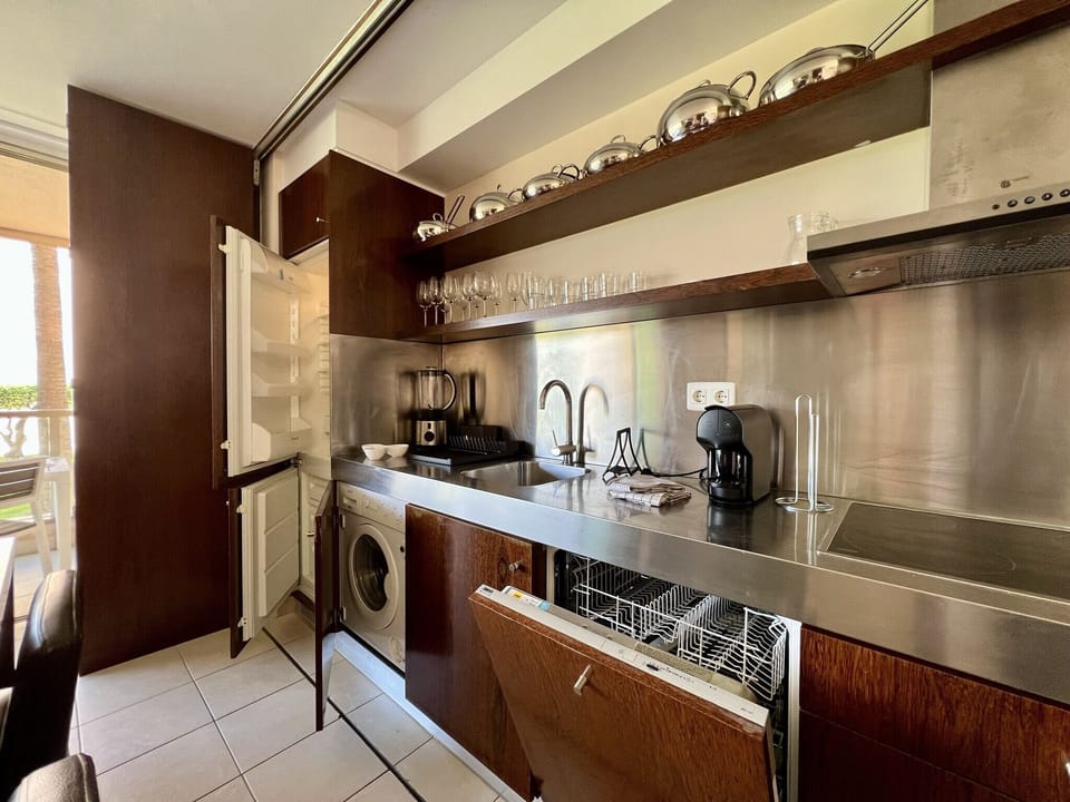 Apartment, 2 Bedrooms, Pool Access | Private kitchen | Coffee/tea maker, microwave, oven, dishwasher
