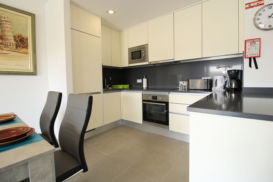 Apartment, 2 Bedrooms, Pool Access | Private kitchen | Coffee/tea maker, microwave, oven, dishwasher