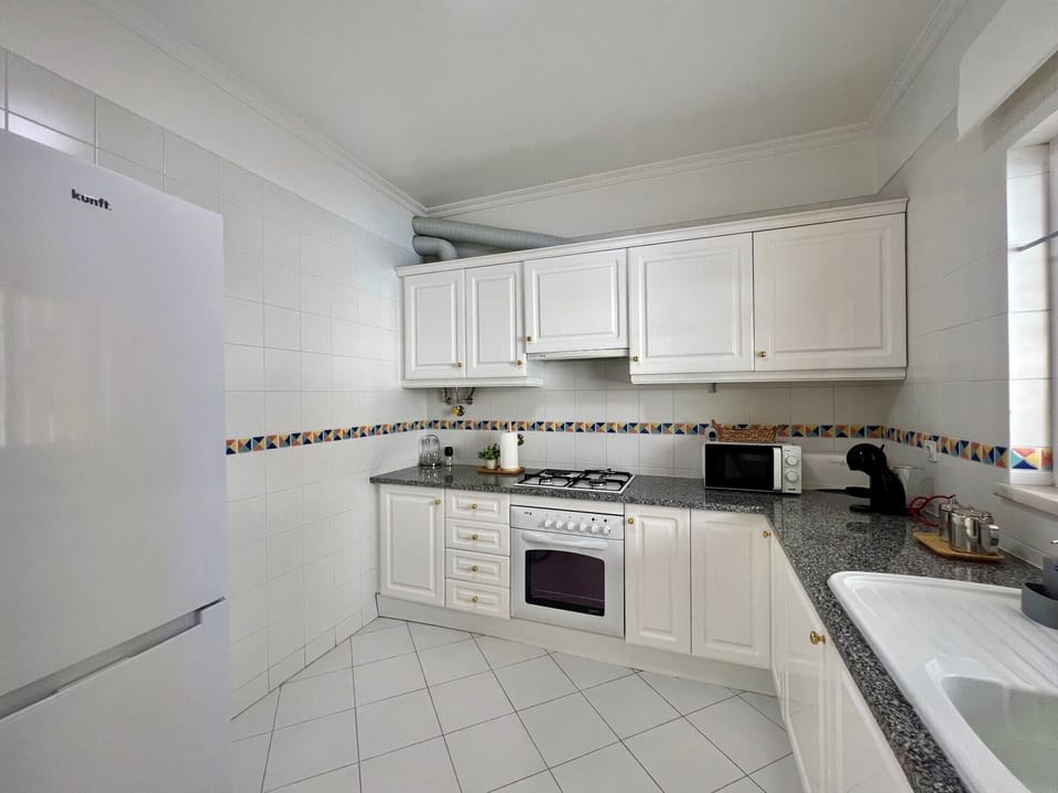 Apartment, 2 Bedrooms, Pool Access | Private kitchen | Microwave, oven, coffee/tea maker, electric kettle