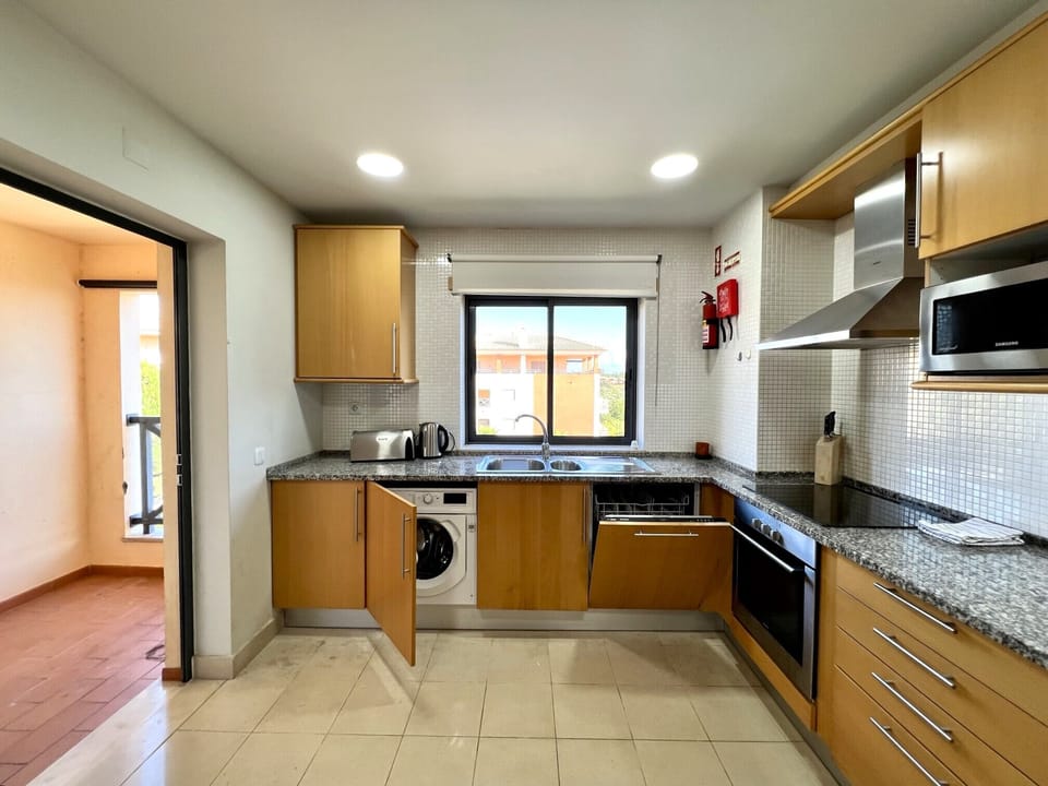 Apartment, 2 Bedrooms, Pool Access | Private kitchen | Microwave, oven, dishwasher, coffee/tea maker