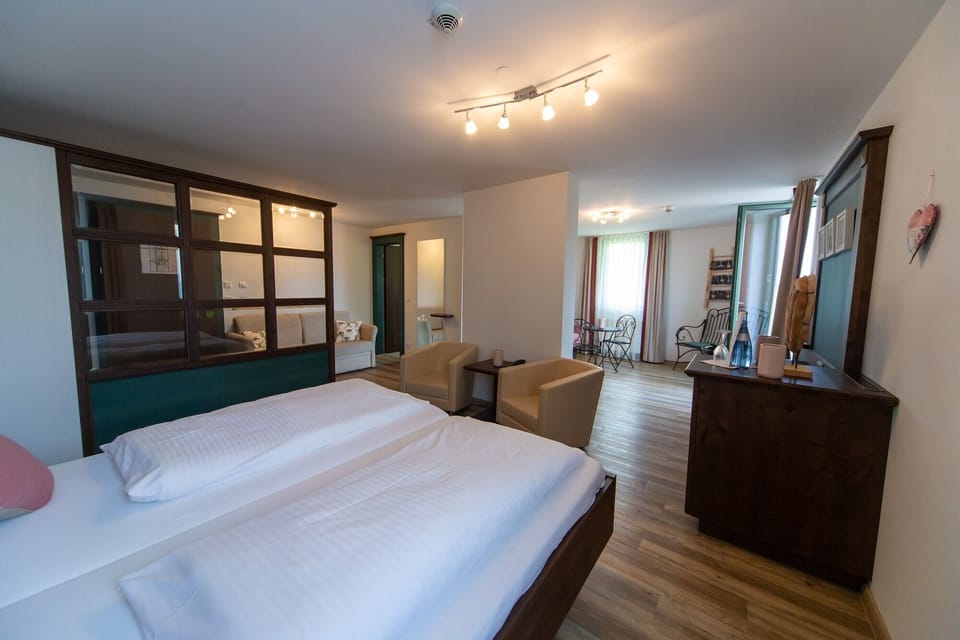 Deluxe Loft, 1 Queen Bed with Sofa bed | In-room safe, individually decorated, desk, blackout drapes