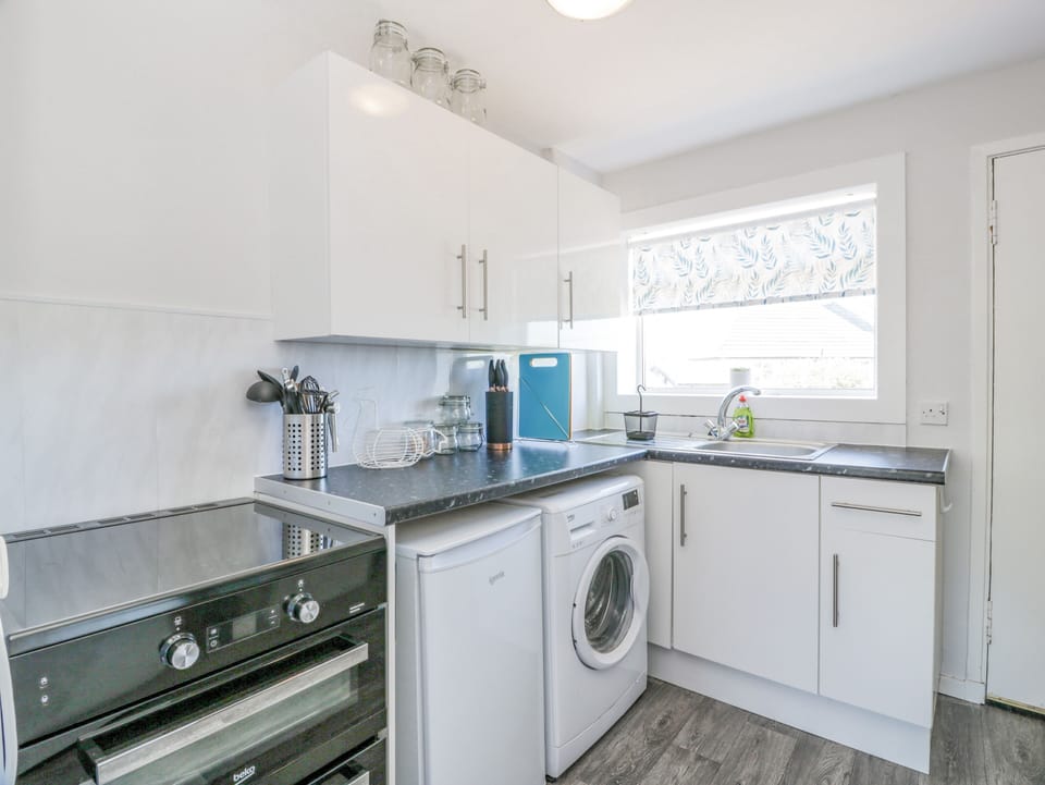 Fridge, electric kettle, toaster, cookware/dishes/utensils