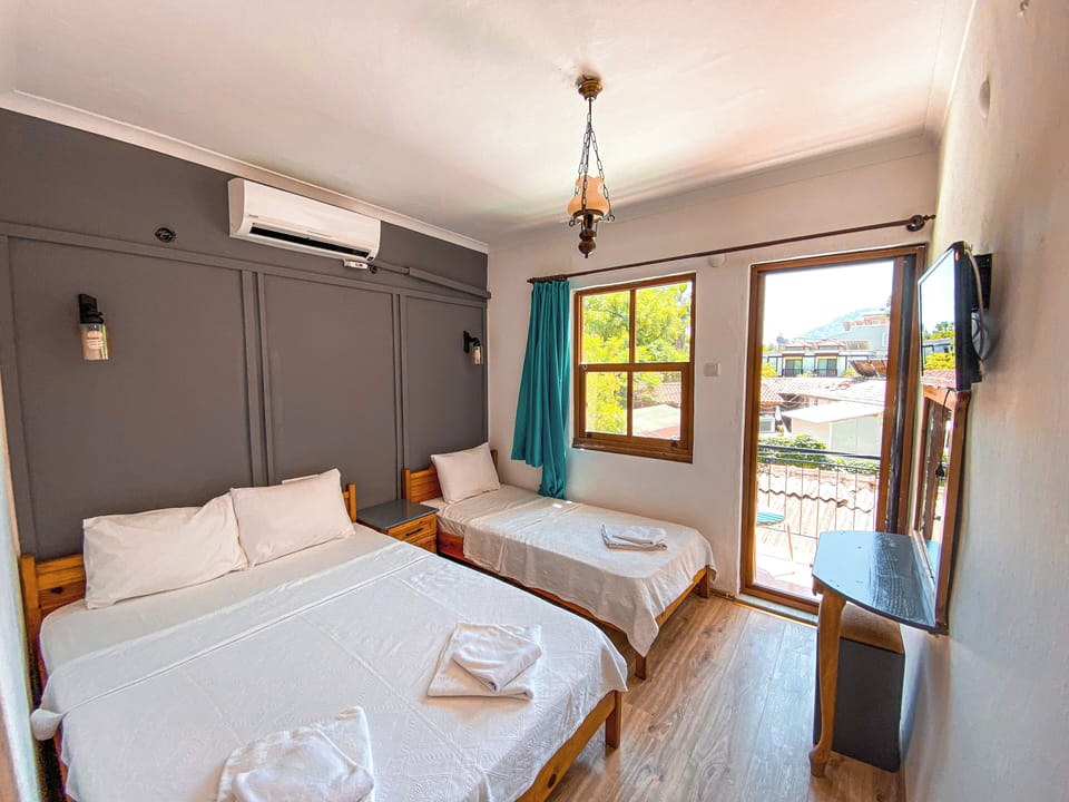 Standard Triple Room, Garden View | WiFi (free), bed sheets