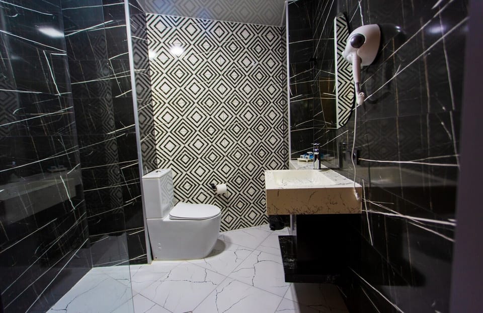 Standard Triple Room | Bathroom | Shower, free toiletries, hair dryer, slippers
