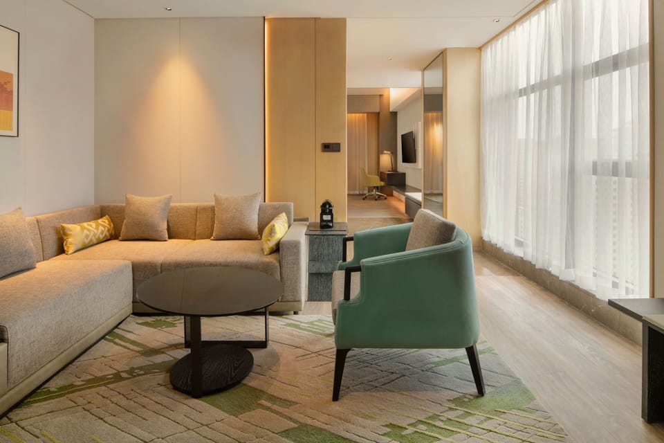 Club Suite, 1 King Bed | Living room | 55-inch LCD TV with cable channels