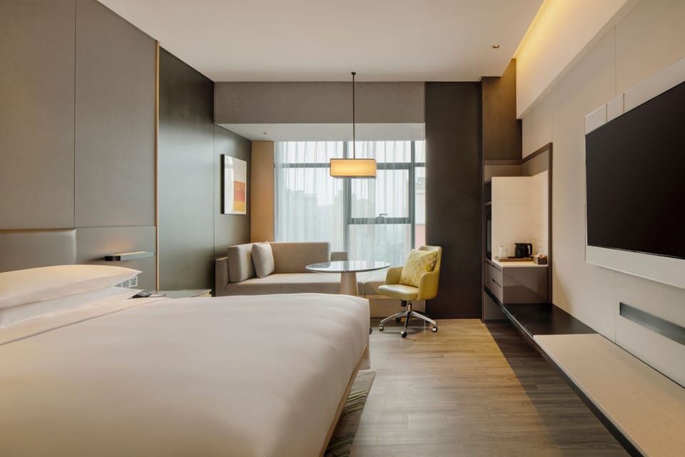 Premium bedding, down comforters, pillowtop beds, minibar