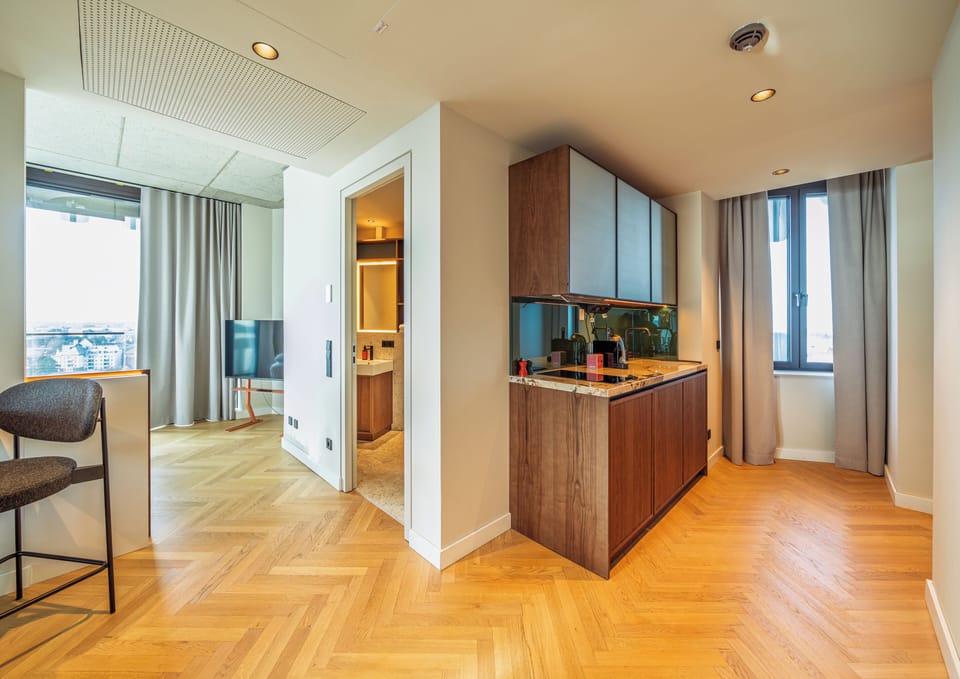 Apartment (SUITE LOGGIA) | Living area | Flat-screen TV, printers