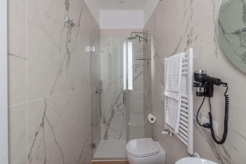 Comfort Room, 1 Large Twin Bed, Balcony, City View | Bathroom | Shower, rainfall showerhead, hair dryer, bidet