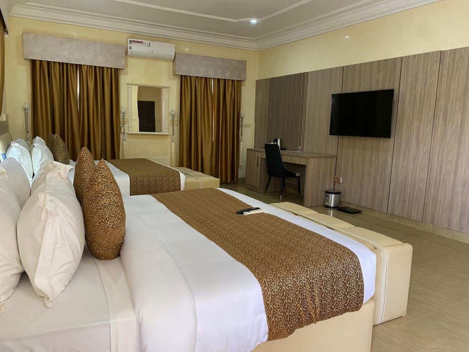 Family Room | Premium bedding, down comforters, in-room safe, desk