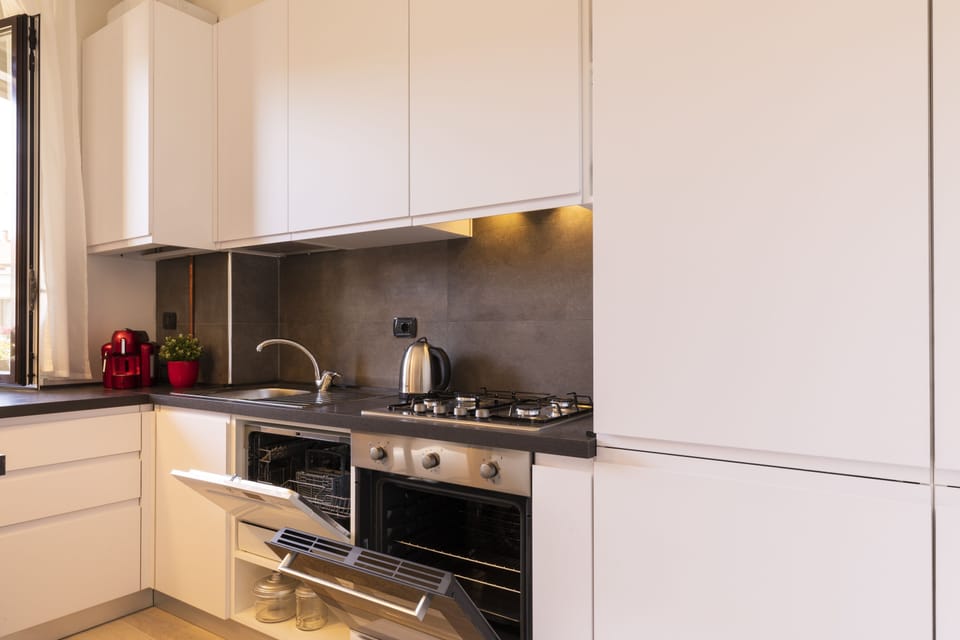 Design Apartment | Private kitchen | Full-size fridge, microwave, oven, stovetop