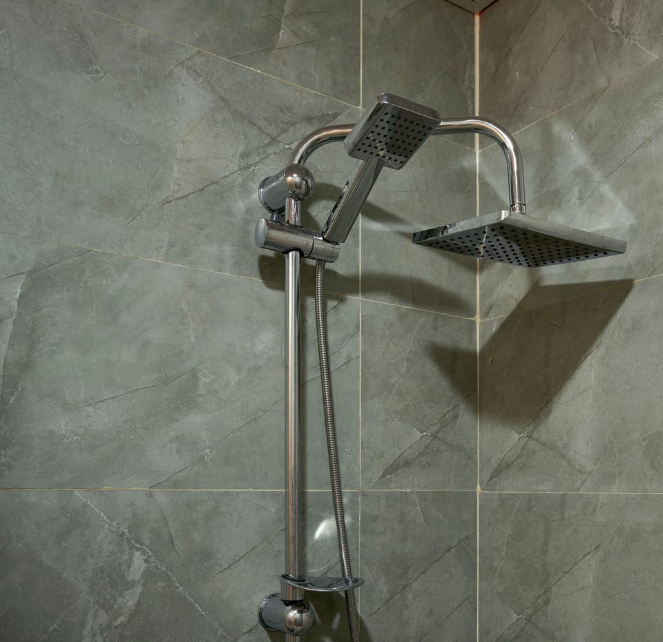 Shower, rainfall showerhead, designer toiletries, hair dryer