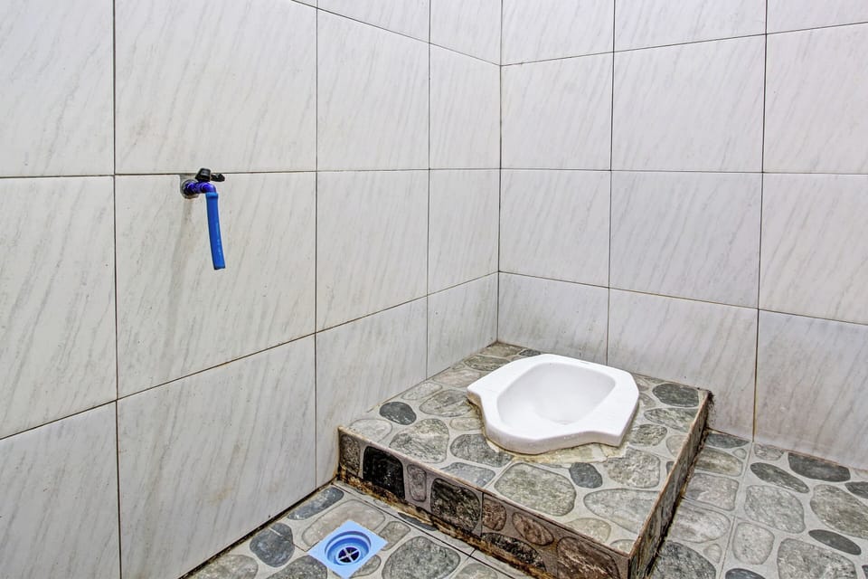Economy Double Room | Bathroom | Shower, rainfall showerhead, soap