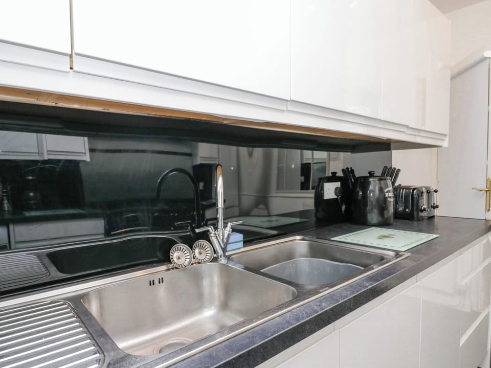 Fridge, electric kettle, toaster, cookware/dishes/utensils