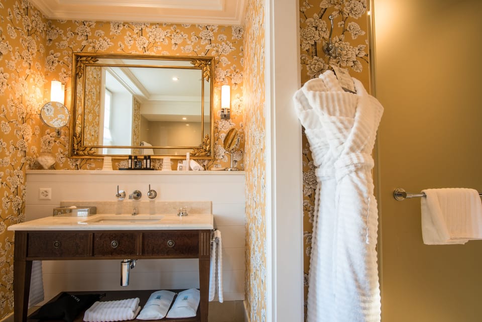 Designer toiletries, hair dryer, bathrobes, slippers