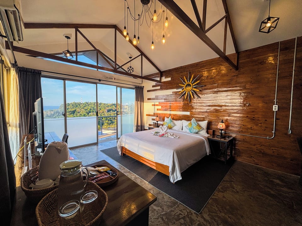 Premium Suite, 1 King Bed, Bathtub, Sea View | Down comforters, individually furnished, blackout drapes, free WiFi