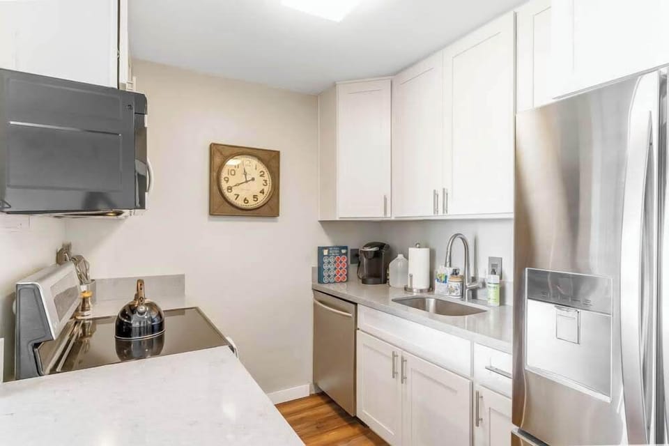 Luxury Condo | Private kitchen | Full-size fridge, microwave, oven, stovetop