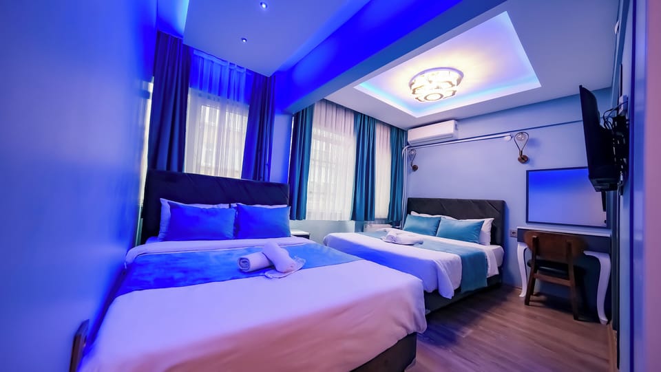 Comfort Quadruple Room, City View | Minibar, soundproofing, free WiFi, bed sheets
