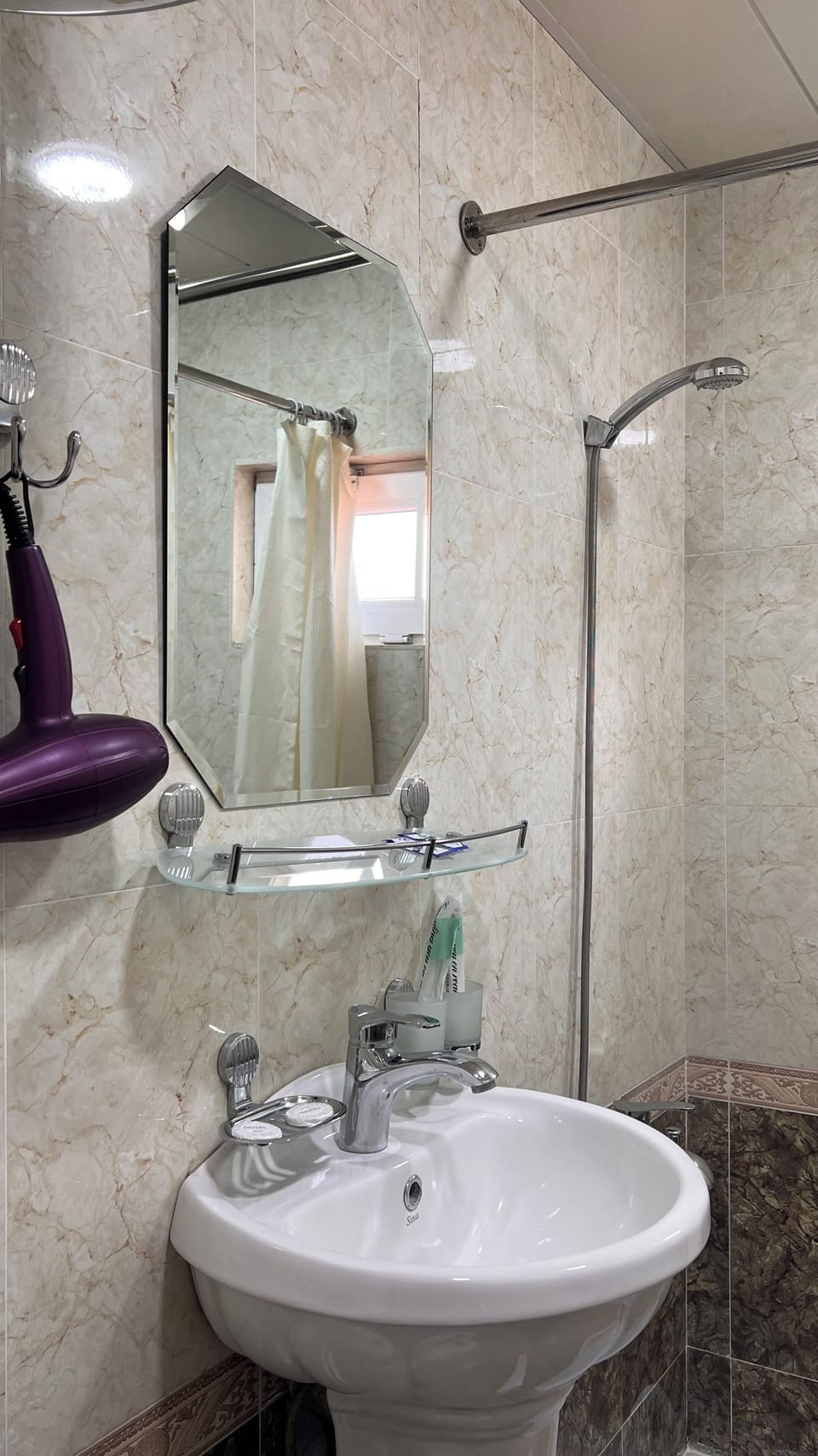 Rainfall showerhead, hair dryer (on request), towels, soap