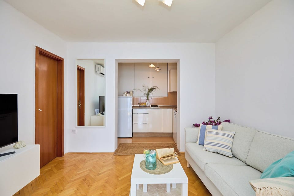 Apartment (1 Bedroom) | Living room | Flat-screen TV