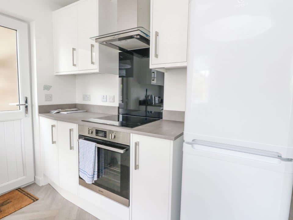 Fridge, electric kettle, toaster, cookware/dishes/utensils