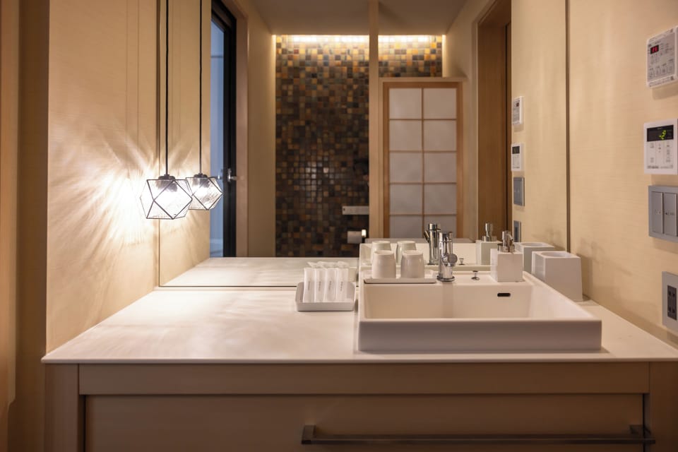 Separate tub and shower, free toiletries, hair dryer, slippers