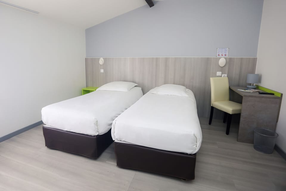 Twin Room | Desk, blackout drapes, free WiFi, bed sheets
