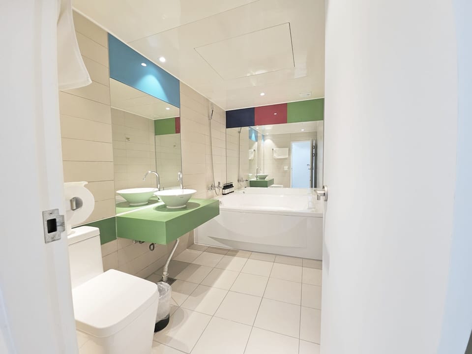 Deluxe | Bathroom | Combined shower/tub, deep soaking tub, hair dryer, bathrobes