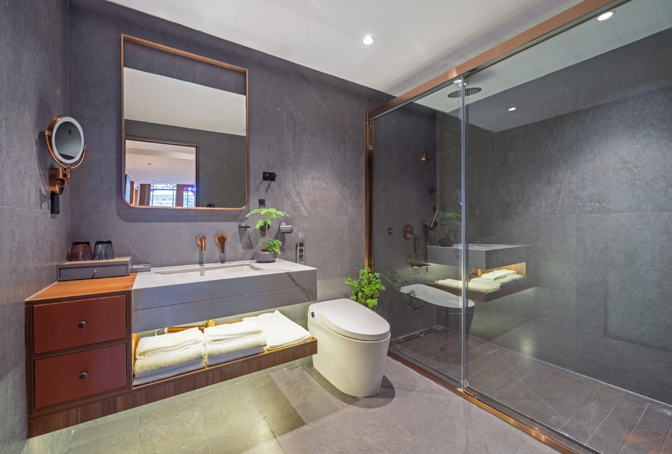 Shower, rainfall showerhead, designer toiletries, hair dryer