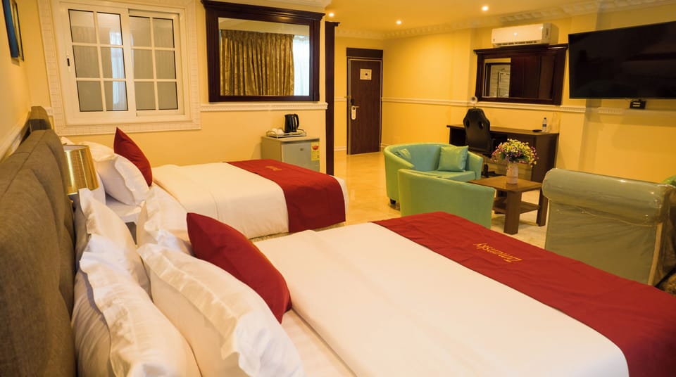 Premium bedding, desk, laptop workspace, soundproofing