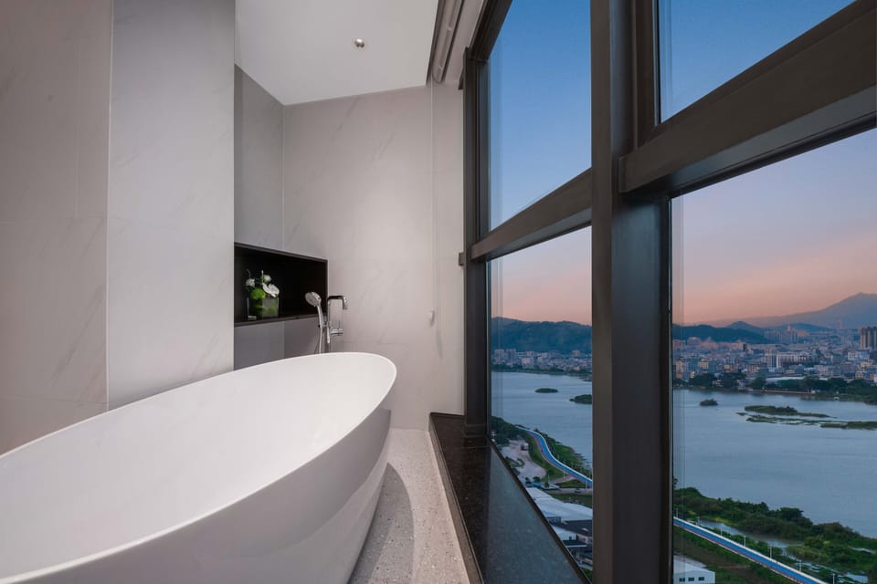 1 King Bedroom Suite River View with Bath | Bathroom | Free toiletries, hair dryer, slippers, towels