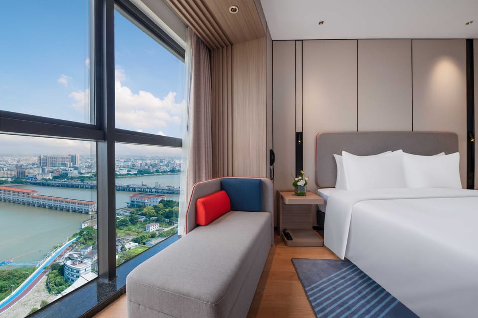 1 King Bedroom Suite River View with Bath | Premium bedding, down comforters, laptop workspace, blackout drapes
