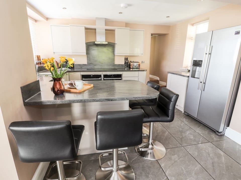 Fridge, electric kettle, cookware/dishes/utensils