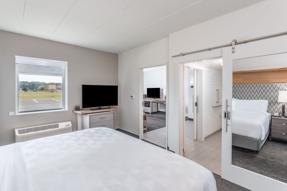 Desk, laptop workspace, blackout drapes, iron/ironing board