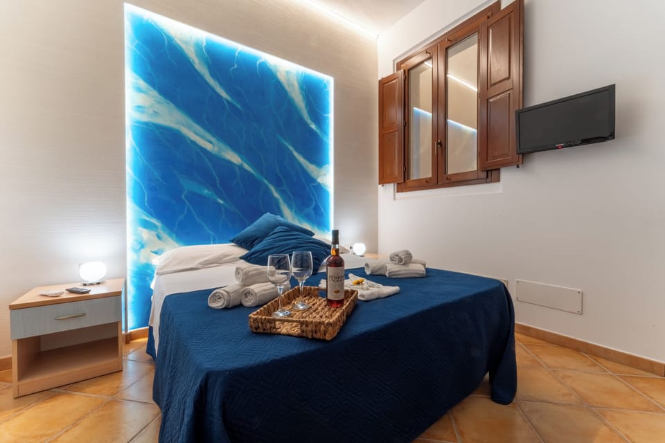 Basic Quadruple Room (Azzurra) | Free WiFi