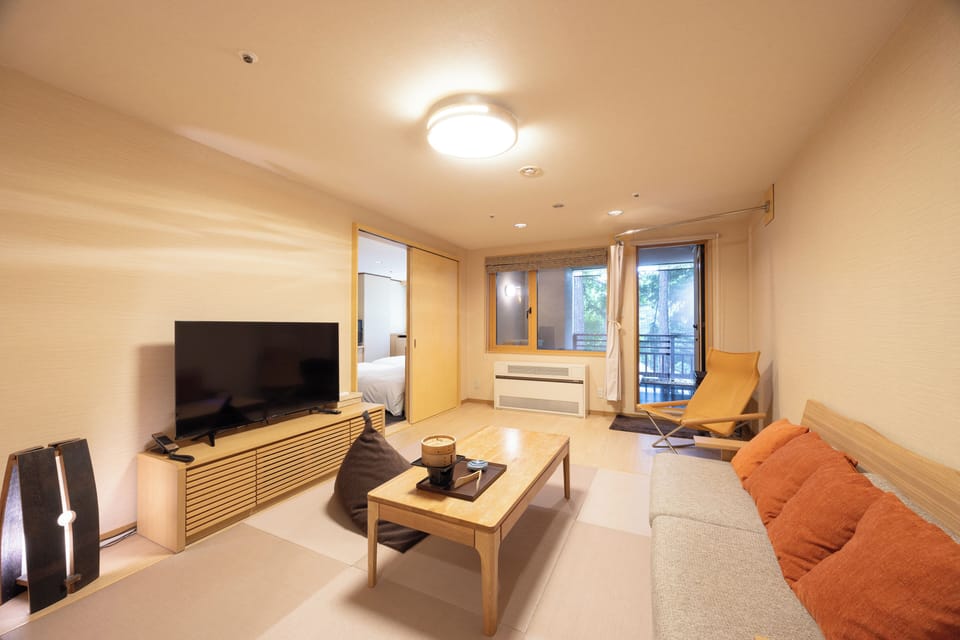 Japanese and Western with Private Open Air Onsen, Non Smoking | Living area | Flat-screen TV, table tennis