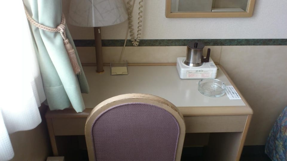 Combined shower/tub, free toiletries, hair dryer, slippers