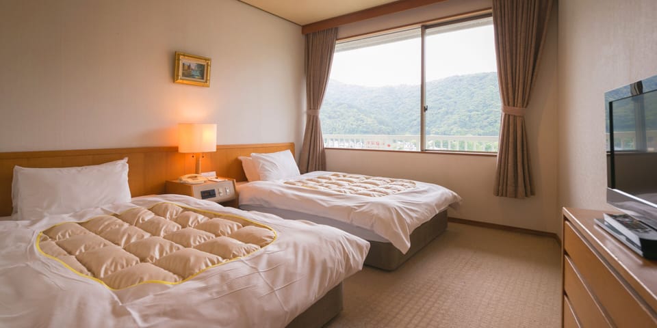 Standard Room, 2 Bedrooms, Smoking | Minibar, in-room safe, desk, iron/ironing board