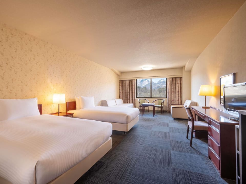 Classic Comfort Twin Room, 2 Single Beds and 2 Sofa, Non-smoking | Down comforters, in-room safe, desk, soundproofing