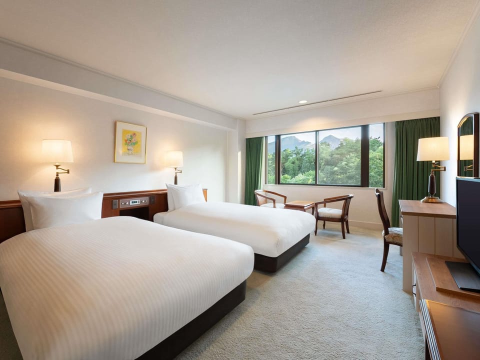 Deluxe Suite, Multiple Beds | Down comforters, in-room safe, desk, soundproofing