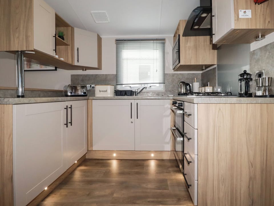 Fridge, electric kettle, toaster, cookware/dishes/utensils