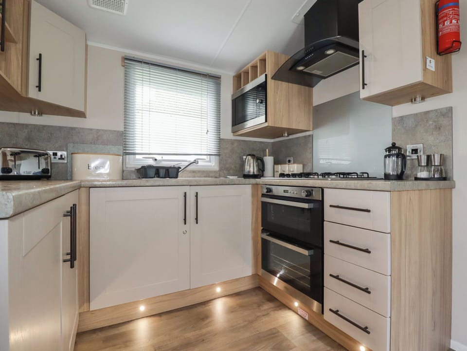 Fridge, electric kettle, toaster, cookware/dishes/utensils